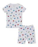 White short-sleeve pyjama top and shorts set with a multicolor space print of rockets, planets, and small triangles.