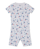 White short-sleeved pyjama top and shorts set with blue whale and fish print, featuring red accents.