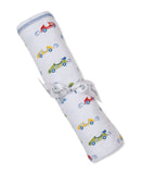 White blanket with a multicolor race car print, blue stitched top edge, and tied with a white satin ribbon.