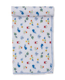 White baby blanket with a repeating pattern of blue whales, green turtles, red crabs, and yellow starfish, with blue stitched