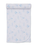 Light blue and white baby blanket with an all-over print of smiling suns, moons, stars, and clouds, featuring a scalloped edg