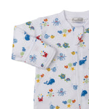 White sleepsuit with multicolor sea creature print (whales, octopuses, crabs, turtles, fish). Features a front zipper and rib
