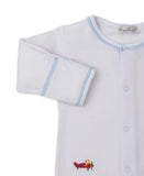 White long-sleeve sleepsuit with light blue stitching on neck and cuffs, snap-button front, and a red biplane embroidery.