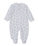 White baby sleepsuit with an all-over light blue teddy bear and star pattern, featuring a full-front zip and integrated feet.