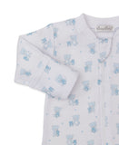 White sleepsuit with light blue teddy bear and star print. Long sleeves with ribbed cuffs, front zipper, and 'kissy kissy' ta