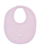 Pink baby bib with scalloped edges, a white embroidered bunny, and a snap closure.