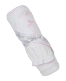 Rolled white towel with pink celestial print, pink scalloped trim, and a gray 'Kissy' ribbon tied in a bow. White terry cloth