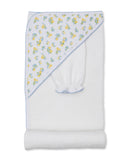 White hooded towel with a yellow lemon and blue flower pattern on the hood, accompanied by a matching wash mitt.