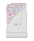 White hooded towel with a pink, blue, and yellow floral print hood, accompanied by a matching white wash mitt with pink trim.
