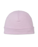 Light pink baby beanie with a rounded crown and a folded brim, made of soft knit fabric.