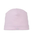 Pink baby beanie with a folded brim, white scalloped trim, and a small white embroidered bunny on the front.