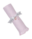 Pink rolled blanket with a white 'Kissy Kissy' ribbon. Features embroidered pink roses and a ruffled edge with pink trim.