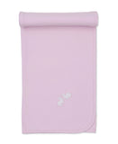 Light pink baby blanket with scalloped edges and two white embroidered bunny motifs on one corner.