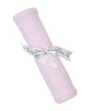 Pink blanket rolled, tied with a white 'kissy kissy' ribbon bow, featuring two white embroidered bunny appliques and a scallo