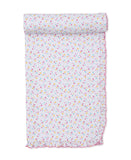 White baby blanket with a pattern of small pink, blue, and yellow hearts, featuring a pink ruffled trim along the edges.