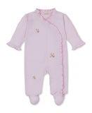 Pink baby sleepsuit with a wrap-over front, ruffled trim along the neckline and opening, floral embroidery, and integrated fo
