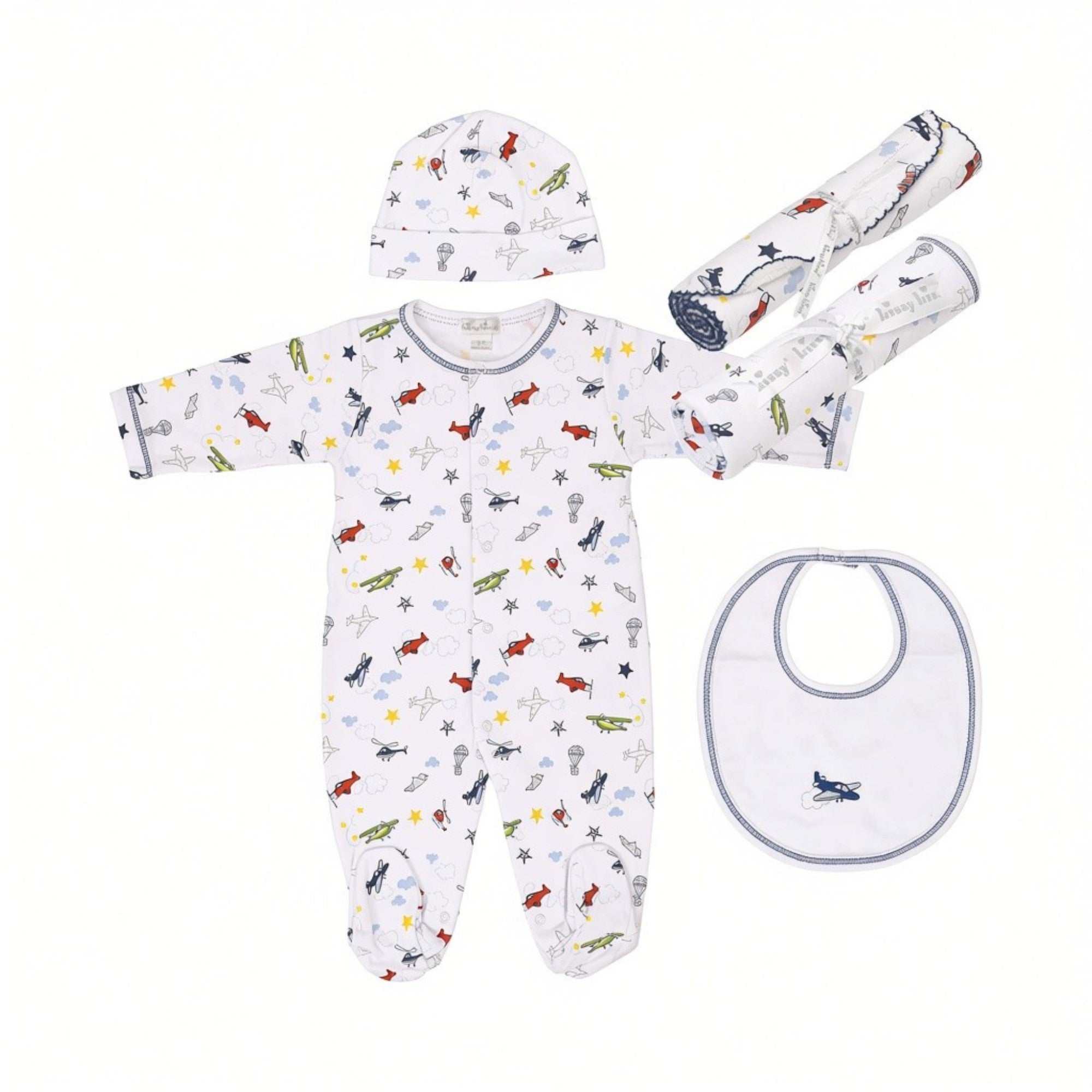 White baby gift set with blue, red, and green aeroplane print, including a sleepsuit, hat, bib, and two swaddles.