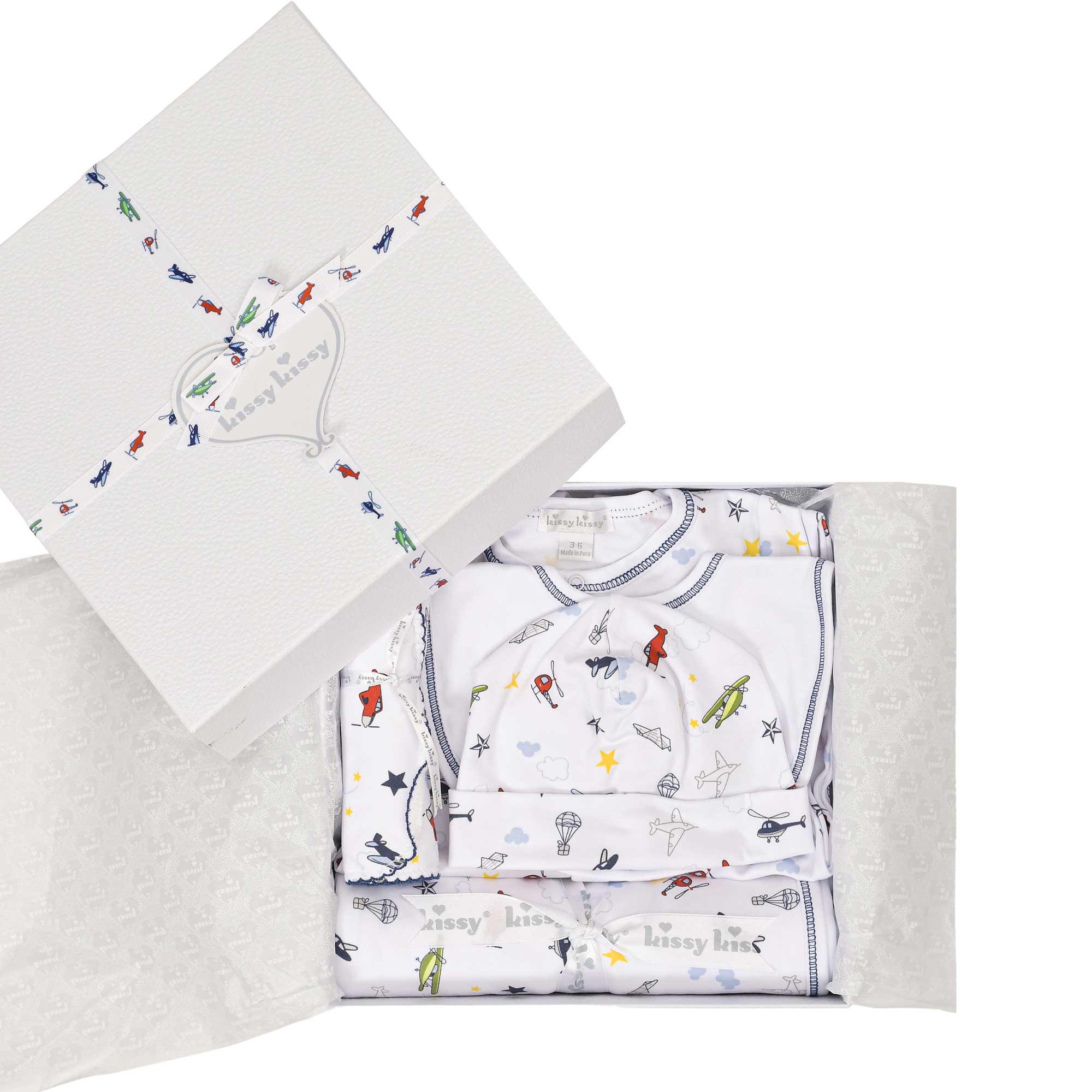 White baby gift set with colorful aviation and sky print, navy trim. White box with a matching ribbon.