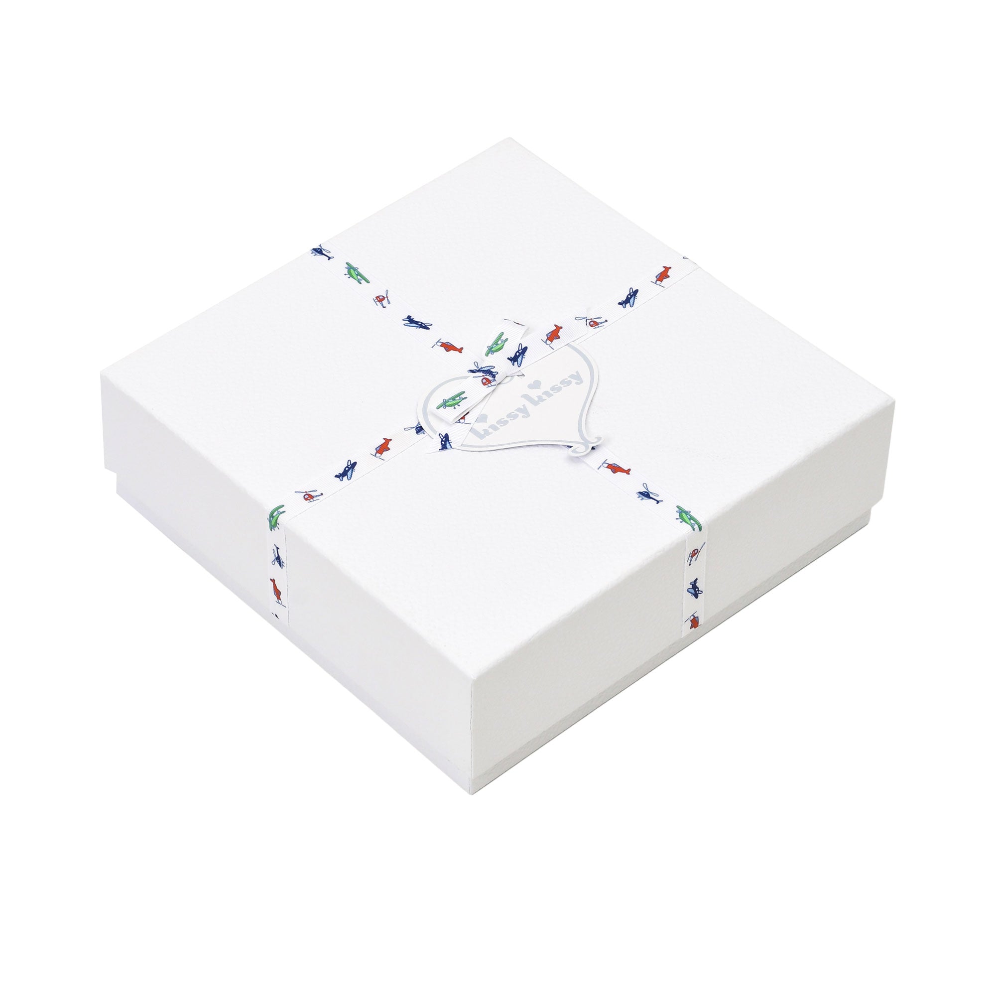 White gift box with a white ribbon featuring colorful airplane motifs, tied with a silver-toned heart tag reading 'kissy kiss