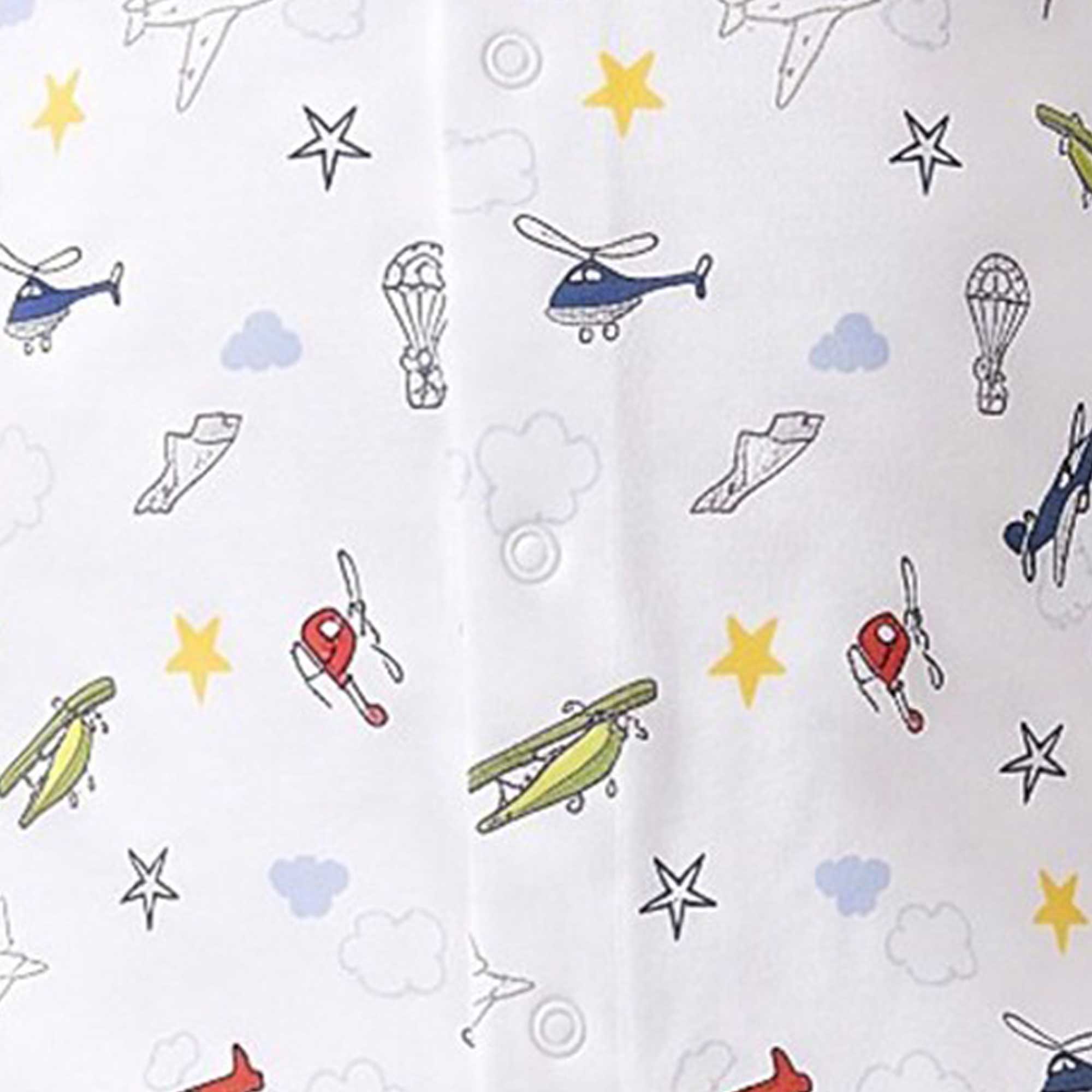 White garment with a pattern of blue helicopters, red/green biplanes, outlined planes, parachutes, yellow stars, and clouds.