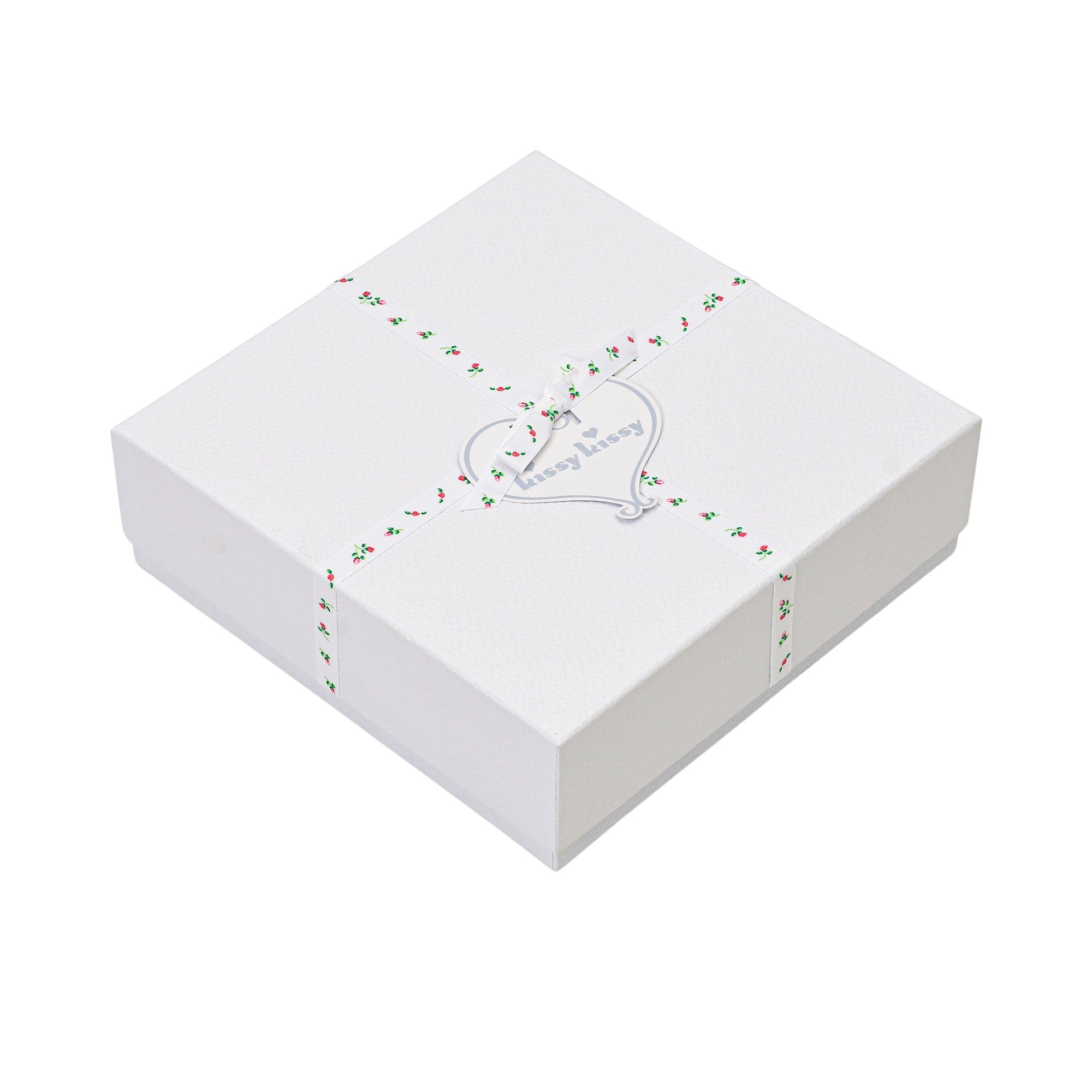 White textured gift box with a lid, wrapped in a white ribbon with small red floral print, tied with a silver-toned heart tag