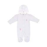 White baby sleepsuit with pink scalloped trim and pink teddy bear embroidery, paired with a matching white beanie hat.