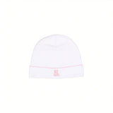 White baby beanie with a pink scalloped hem and a small pink embroidered teddy bear.
