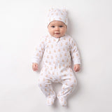 White sleepsuit and hat set with tan teddy bear print. Sleepsuit has a front zipper and footed design. Hat has small ears.