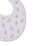 White baby bib with a pattern of light brown teddy bears and stars, featuring a scalloped light brown trim.