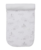 White burp cloth with a silver celestial pattern featuring moons, stars, suns, and clouds, finished with a scalloped edge.