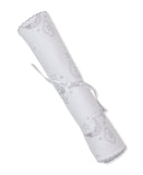 White burp cloth with silver-toned scalloped trim, rolled and tied with a ribbon. Features a grey celestial print.