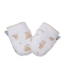 Pair of white baby mittens with tan teddy bear and paw print pattern, featuring ribbed cuffs and scalloped edges.