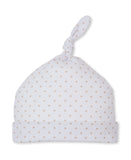 White fabric baby hat with an all-over tan star print, a folded brim, and a knotted top.