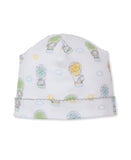 White baby beanie with multicolor hot air balloon, animal, cloud, and sun print. Scalloped grey trim.