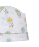 White baby hat with multicolor hot air balloon and animal print, featuring a gray scalloped brim.
