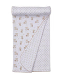 White baby blanket with tan teddy bear print on one side and tan stars on the reverse, finished with a scalloped tan trim.