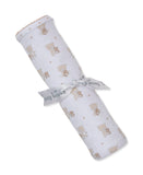 Rolled white blanket with tan teddy bear and star print, scalloped tan trim, and a white 'kissy kissy' ribbon.