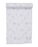 Silver-grey and white knit baby blanket with an all-over pattern of stars, moons, clouds, and suns, featuring a scalloped edg