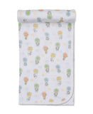 White blanket with a colourful hot air balloon and animal pattern, featuring a scalloped edge.