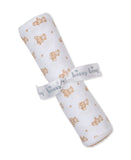 Rolled white blanket with an all-over tan teddy bear and paw print pattern, secured with a light gray 'kissy kissy' ribbon.