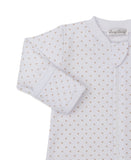 White sleepsuit with tan star print, long sleeves with ribbed cuffs, and a front zipper with a placket.