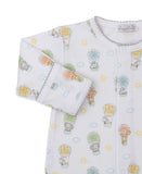 White long-sleeved sleepsuit with multicolor hot air balloon and animal print, featuring gray scalloped trim on neckline and