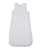 White baby nest with a light grey celestial pattern of moons, stars, clouds, and suns, featuring a sleeveless design and snap
