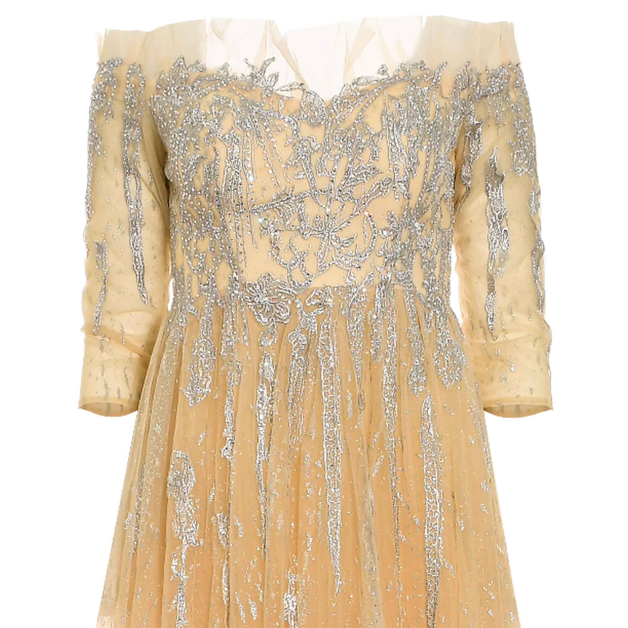 Beige off-the-shoulder tulle dress with silver-toned floral embroidery on the bodice and dripping patterns on the skirt. Shee