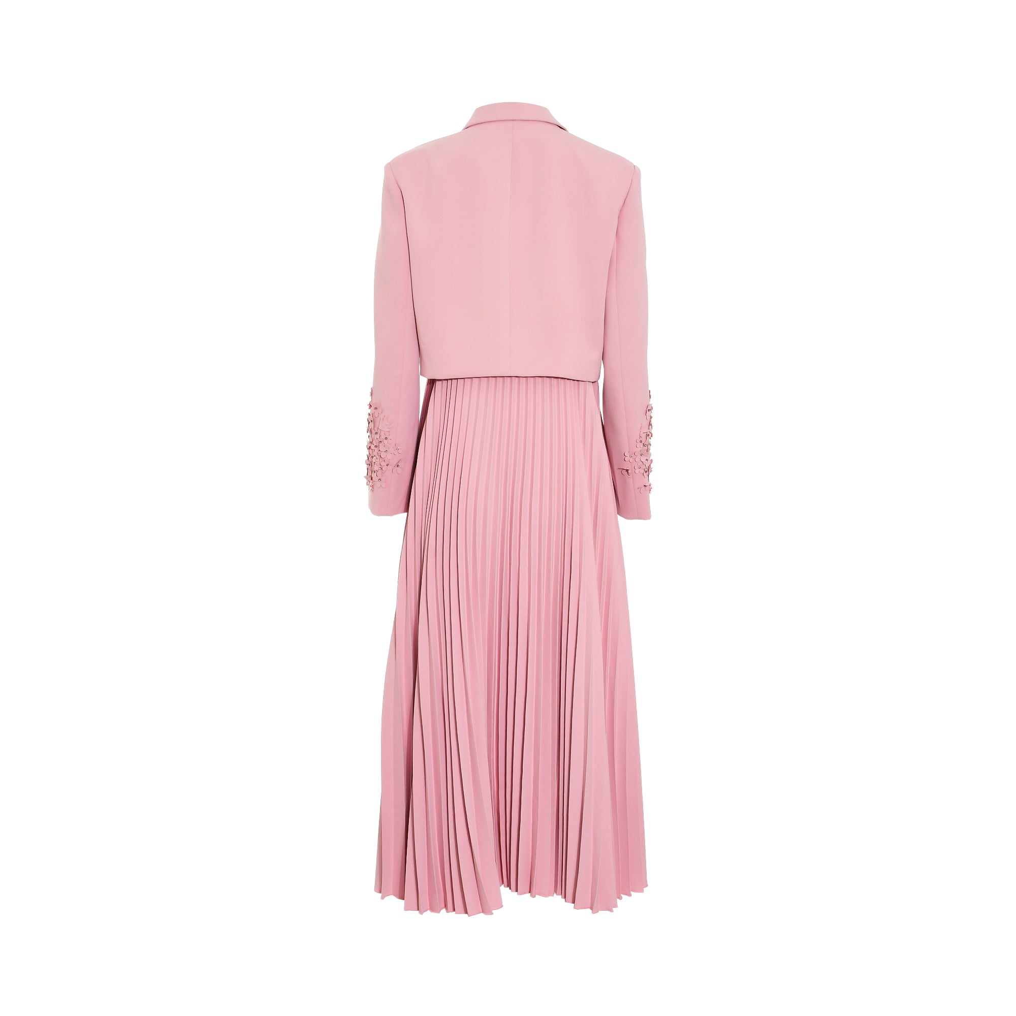 Pink dress with a collared, cropped jacket-style top featuring floral appliques on the sleeves, and a long, pleated skirt.