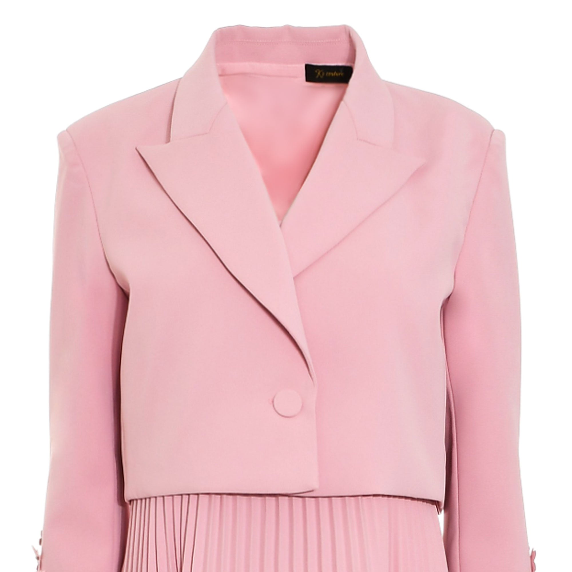 Pink dress with a cropped blazer-style top, notched lapels, a single front button, long sleeves, and a pleated skirt.