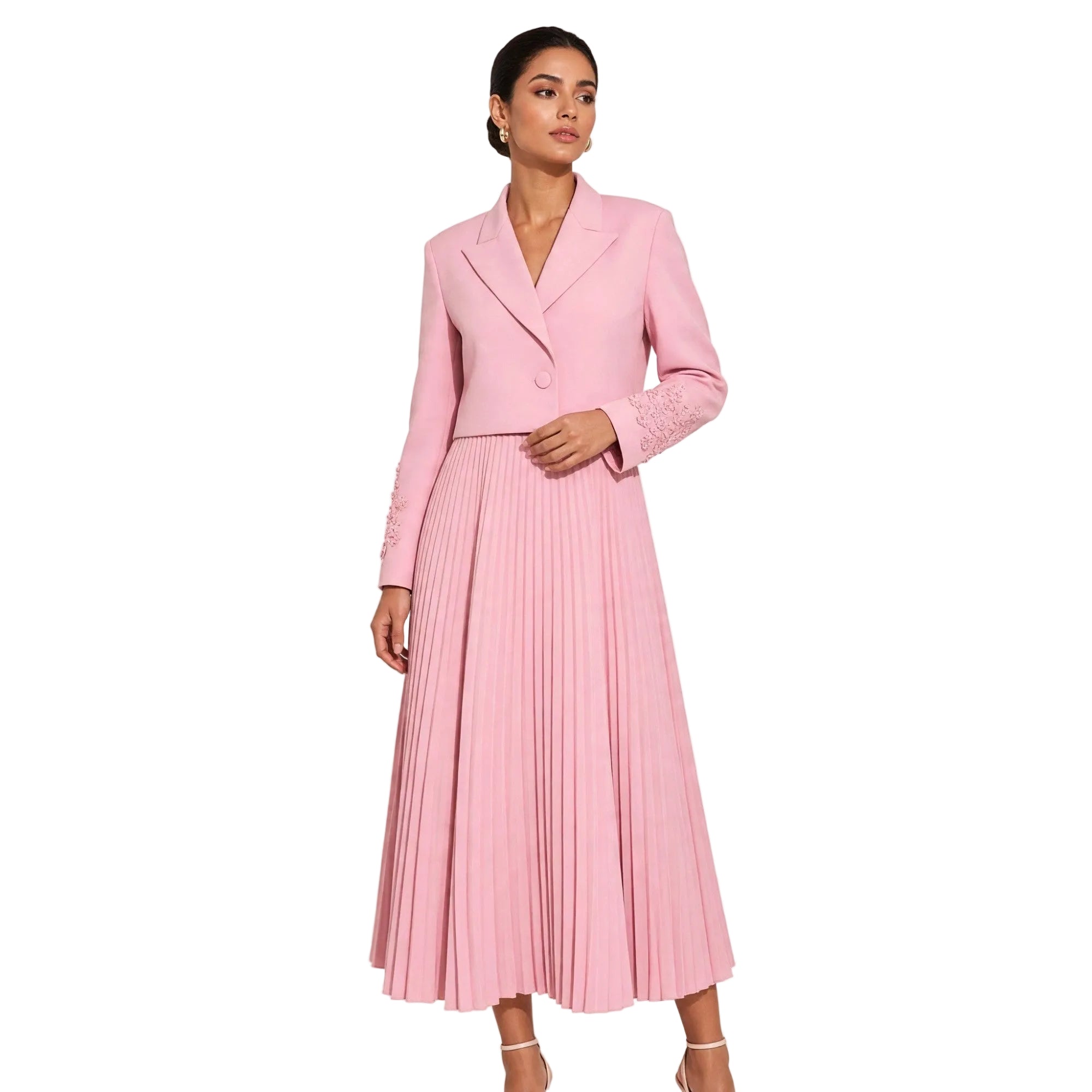 Pink blazer-style cropped bodice dress with notched lapels, embellished long sleeves, and a pleated midi skirt.