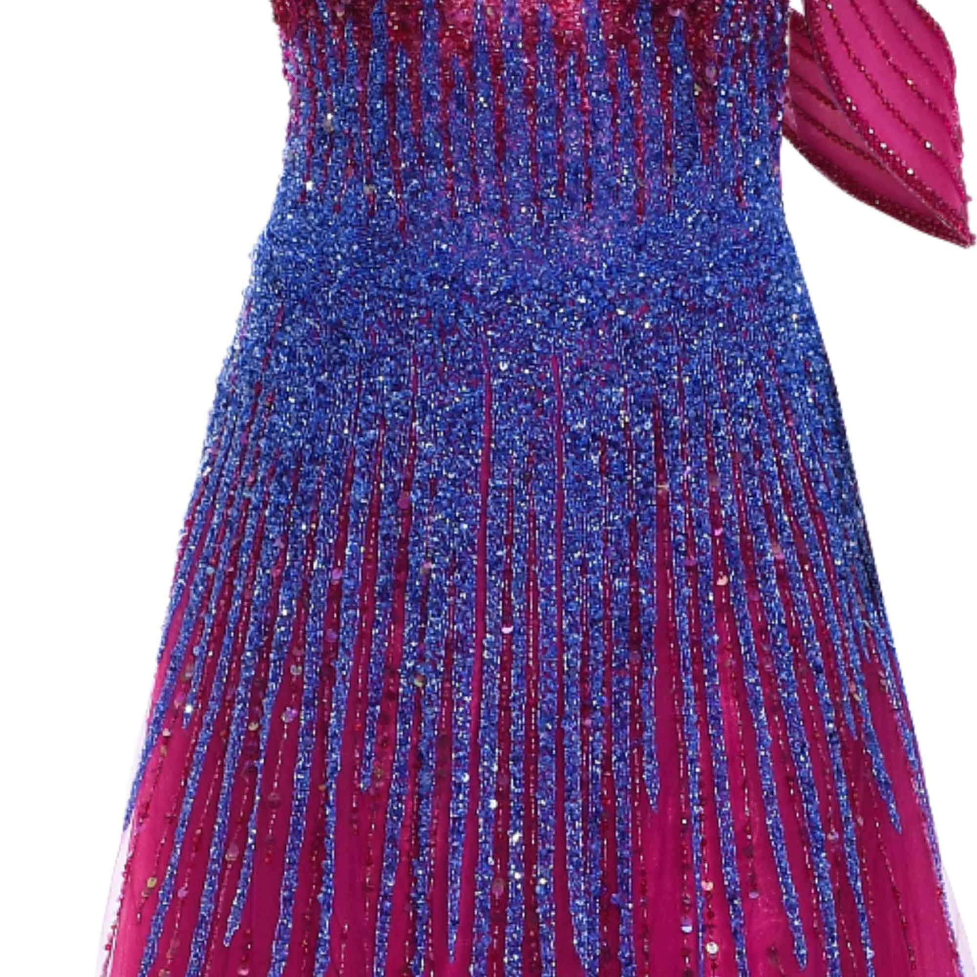 Pink dress with dense blue beading and sequins, forming vertical patterns. Features a pink draped shoulder detail.