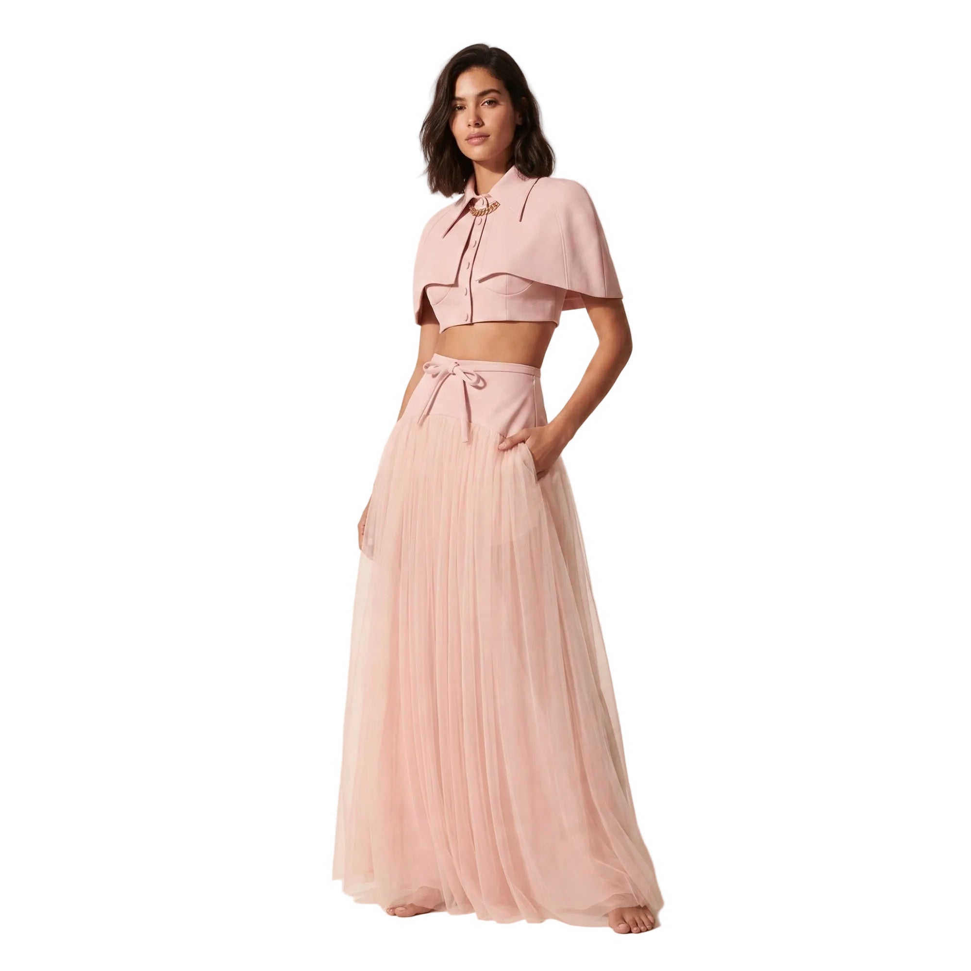 Pink two-piece dress featuring a cropped cape-style top with a collar and a high-waisted maxi skirt with a pleated tulle over