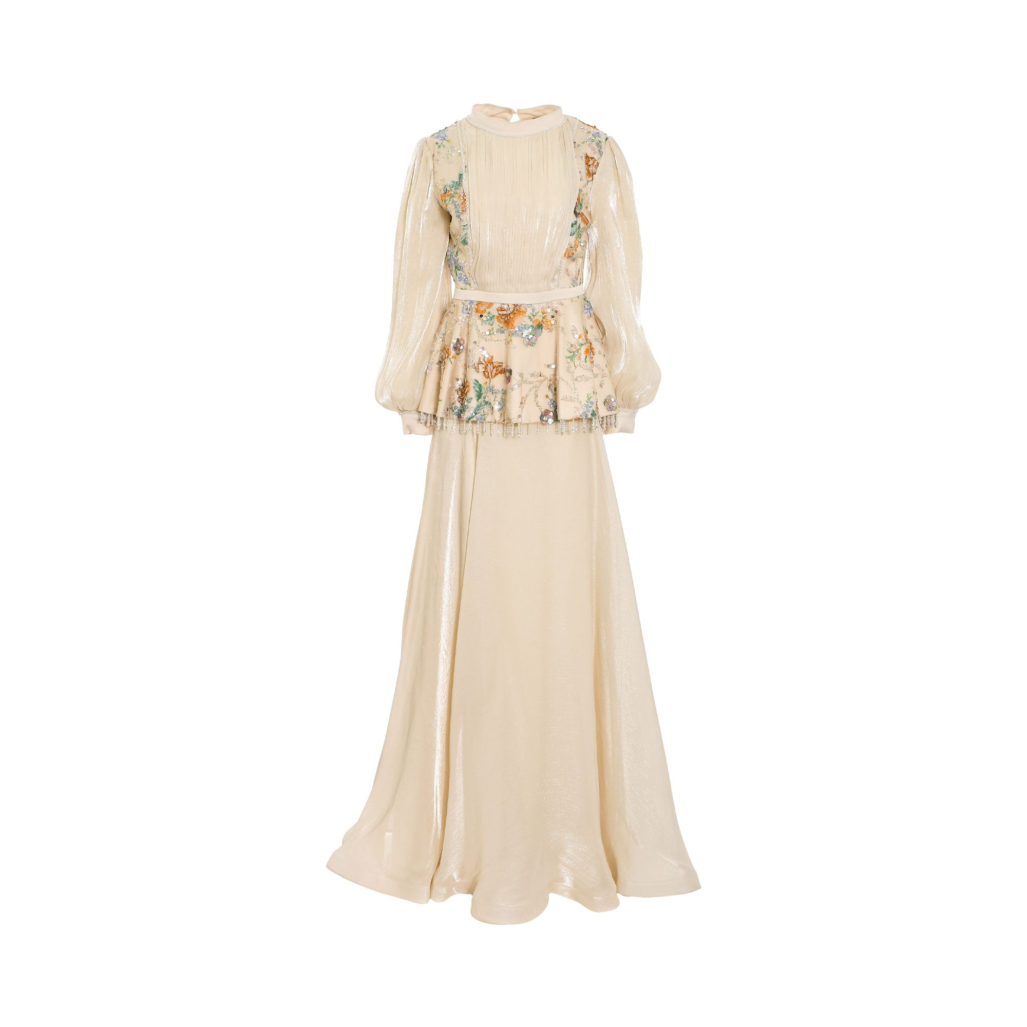 Beige high-neck top and matching long skirt set. Top features voluminous sleeves, a peplum waist with floral embroidery and b